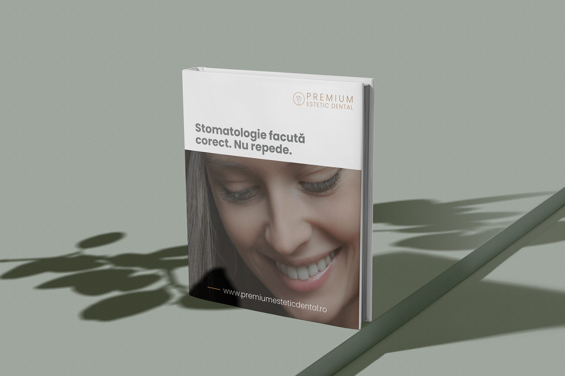 Premium Estetic Dental printed brand book mockup with a smiling woman on the cover